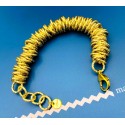 Bracciale rondelle large in alluminio dorato satinato