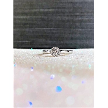 Solitario oro bianco con diamante centrale 0,10ct e contorno 0,03ct