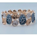 Bracciale armonia elasticizzato in ottone con cerchi alterni perlati