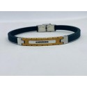 Bracciale caucciù e inserto acciaio dorato e 7 zirconi neri