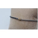 Bracciale acciaio mezzo giro tennis, centrale dorato con strass nero incassato