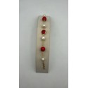 Bracciale in acciaio dorato con perle e pietre dure color rosso
